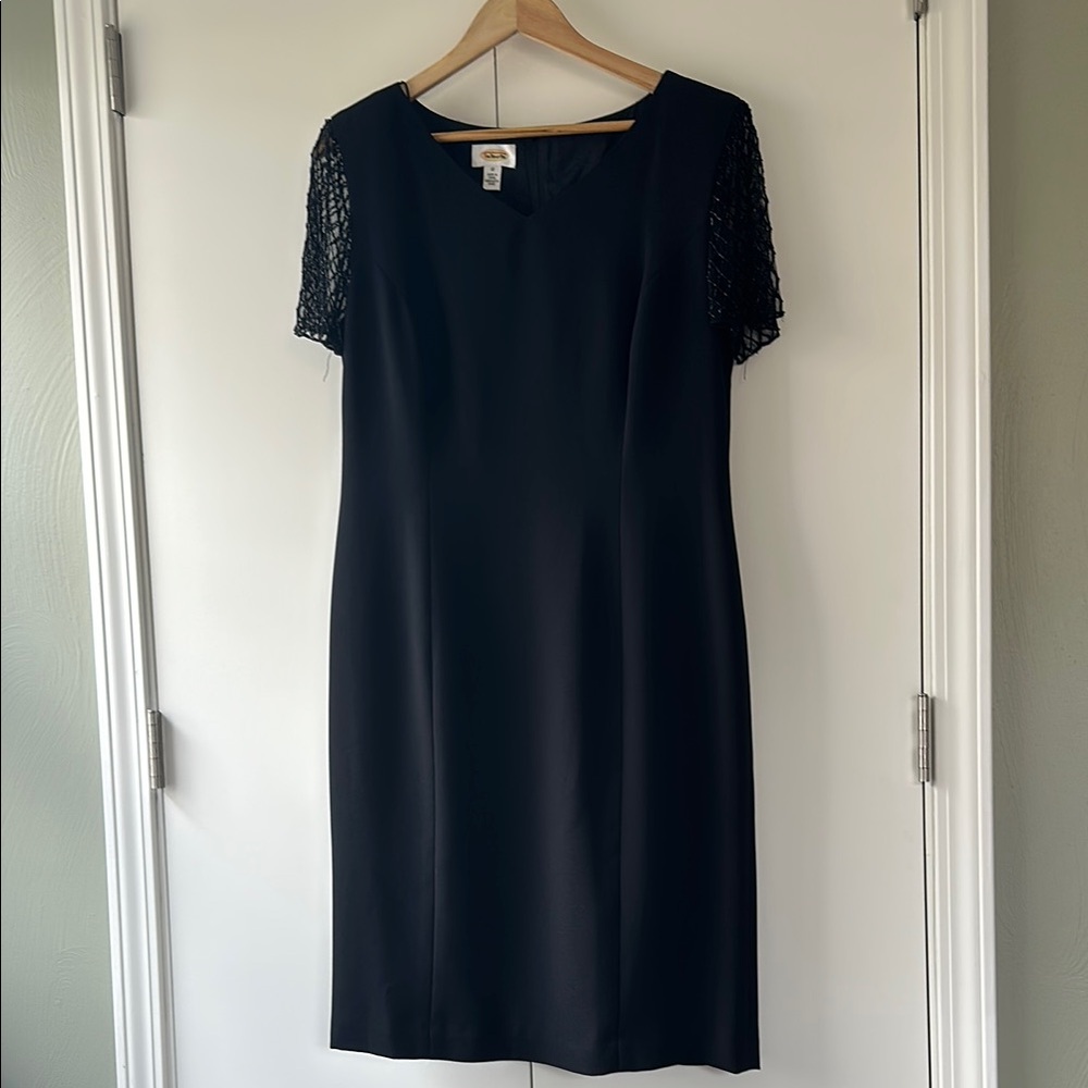 VINTAGE 1990’s black structured dress with shoulder pads and beaded sleeves